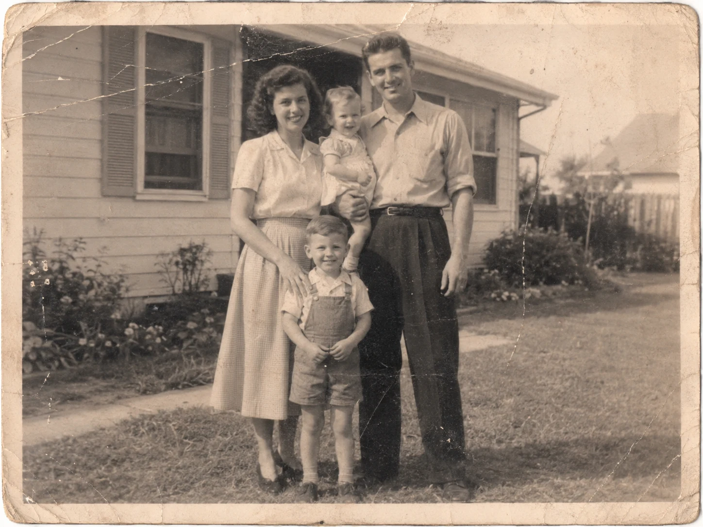 Damaged vintage family photograph before Old Photo Rescue